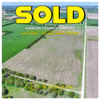Aerial view of 44.6 acres of tillable farmland sold at Marion County Kansas land auction northeast of Goessel, showing open fields and township road access.